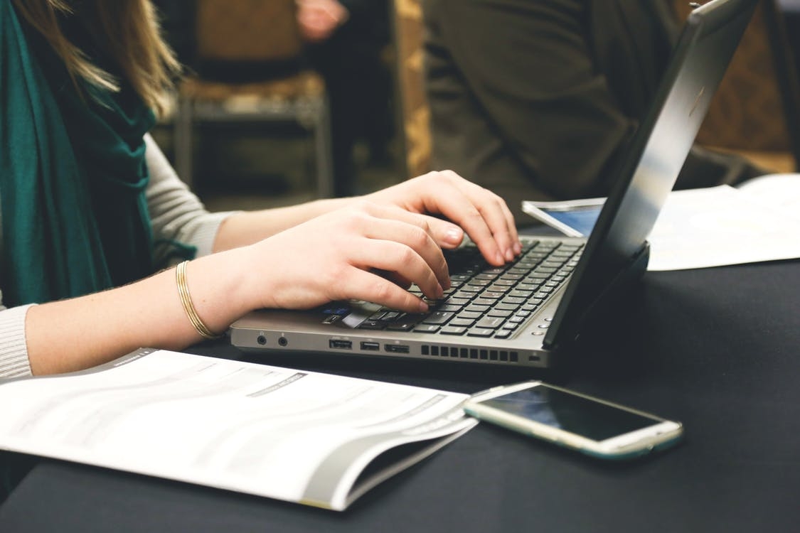 woman typing her resume